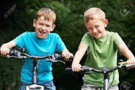 Two Boys Riding Bikes Together Stock Photo, Picture And Royalty Free Image. Image 49380549.