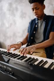 Boy Playing Piano · Free Stock Photo