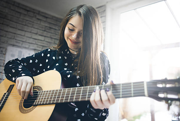 13,514 Girl Playing Guitar Stock Photos, Pictures & Royalty-Free Images - iStock