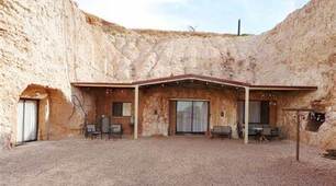 33. A PLACE TO LIVE. Reading "Australia’s Underground Homes!"