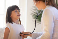 Pediatrician With Stethoscope Listening To Lung And Heart Sound Of Child Stock Photo - Download Image Now - iStock