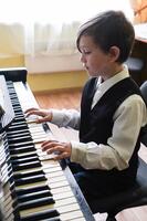 Premium Photo | Portrait of kid playing piano, young boy learning music with an piano in musical scholl. child relaxing playing piano