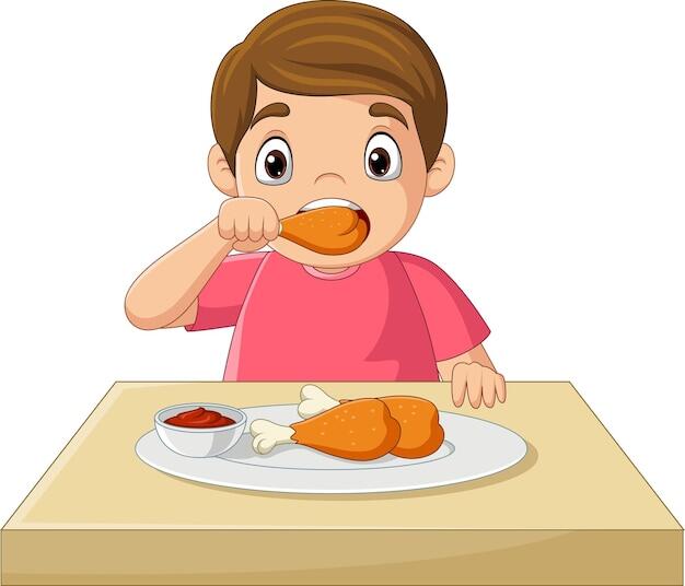 Premium Vector | Cartoon little boy eating fried chicken