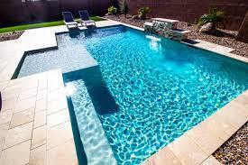 Back Yard With Two Lounge Chairs And Swimming Pool Stock Photo - Download Image Now - Swimming Pool, Back Yard, Waterfall - iStock