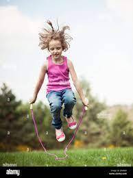 Girl skipping hi-res stock photography and images - Alamy